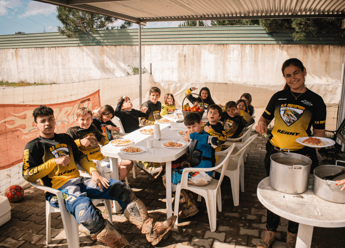 Bruna Antunes enjoying a break with riders at the summer camp