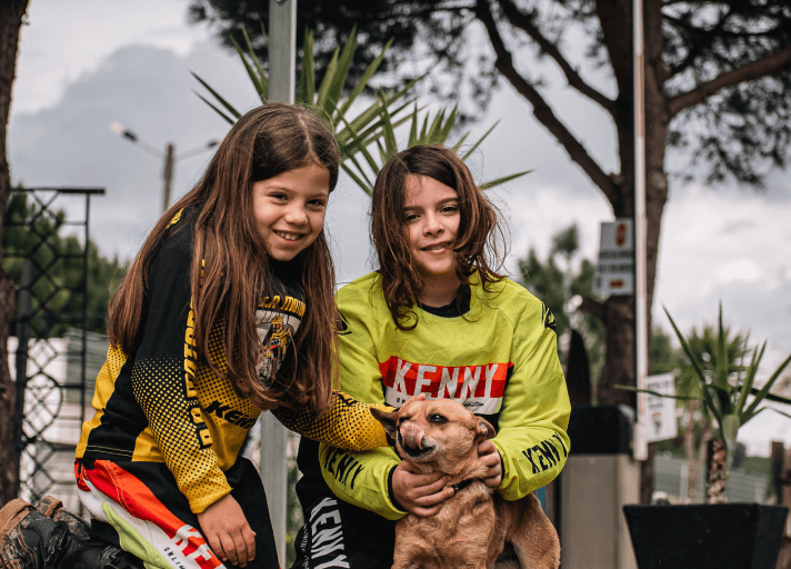 Group of female motocross riders at camp with Bruna Antunes