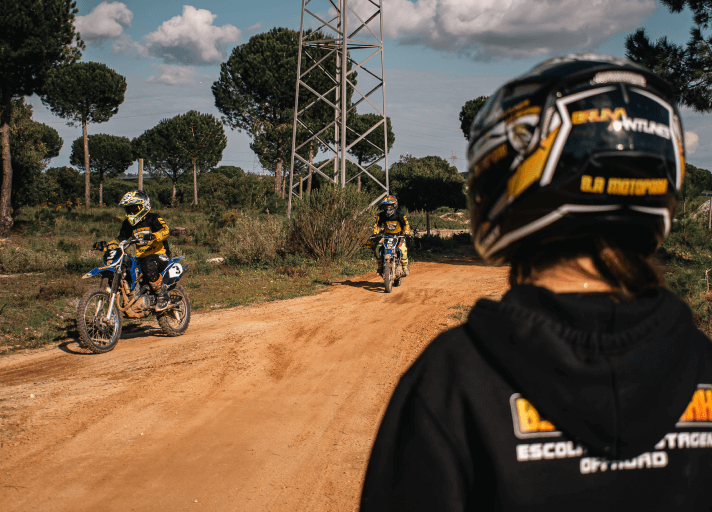Bruna Antunes instructing adult riders at her motocross school