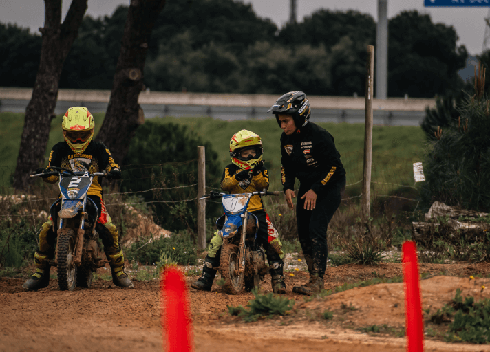 Bruna Antunes giving motocross instructions to adult riders